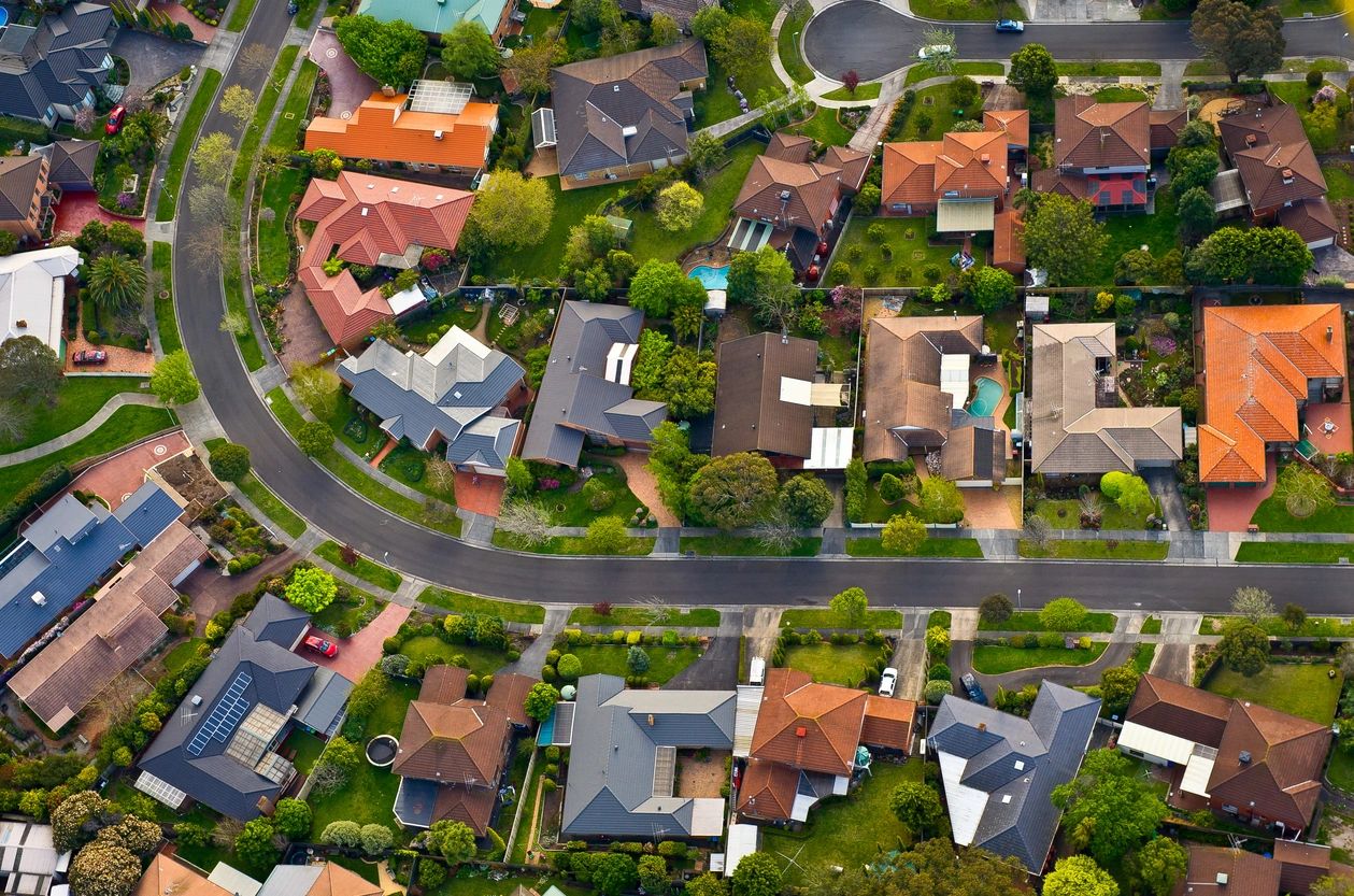 A view of houses from above, showing the street.